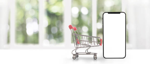 istock device touching screen with shopping cart and 2165291542