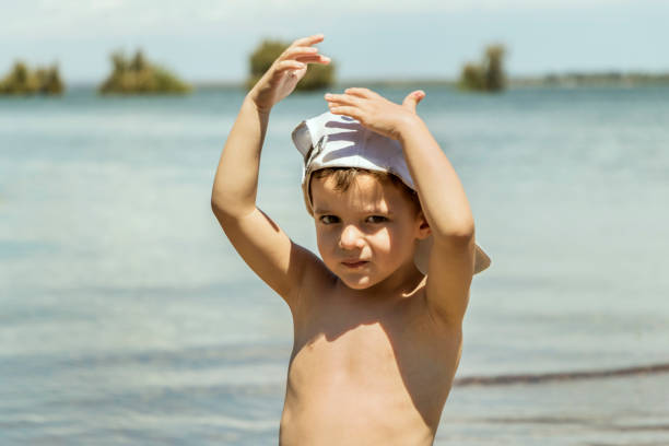 Smiling little boy, enjoying outdoors.