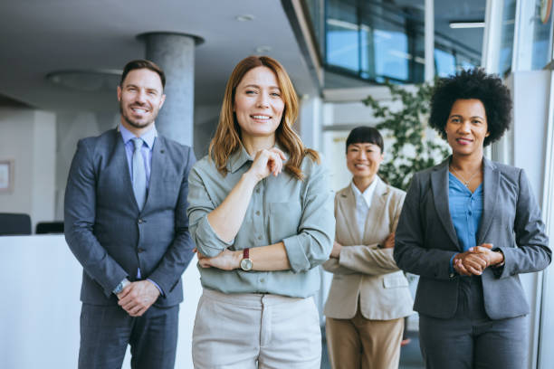 istock Confident female leader with diverse business team 2165292527
