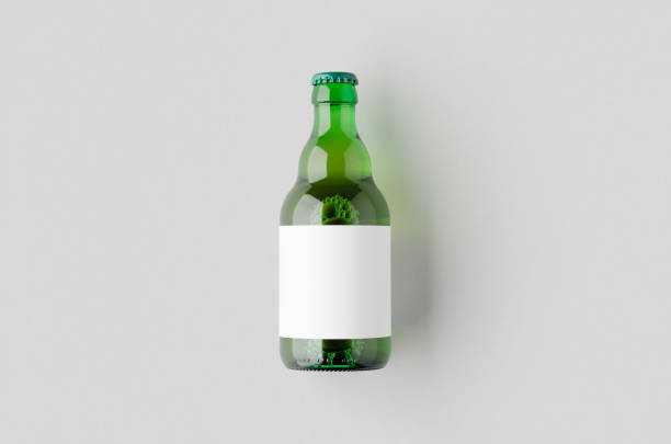 istock Green steinie beer bottle mockup with blank label. 2165292765