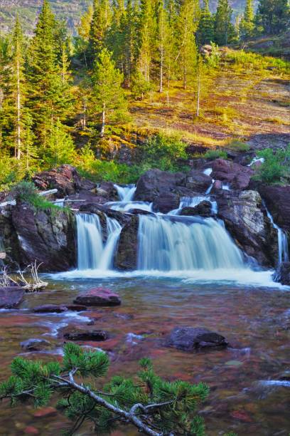istock Redrock Falls Glacier National Park Montana 2165295132