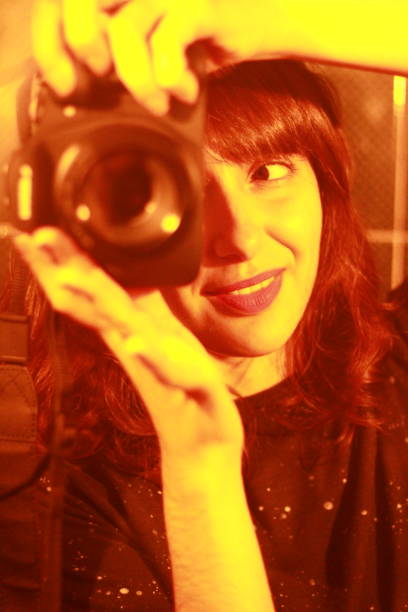 Young Woman Taking Photos with Camera