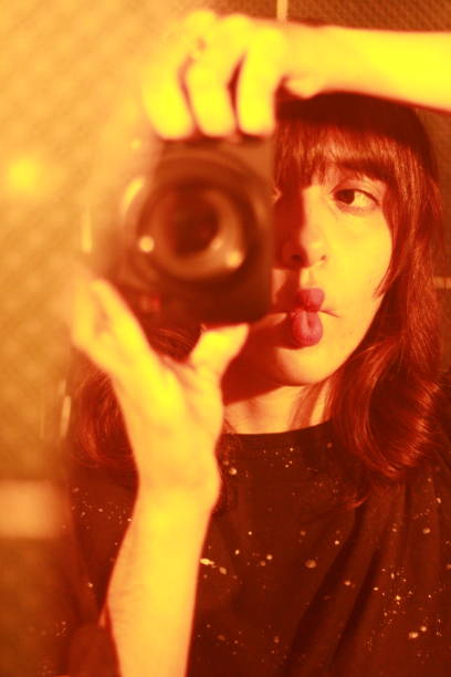 istock Young Woman Taking Photos with Camera 2165295755