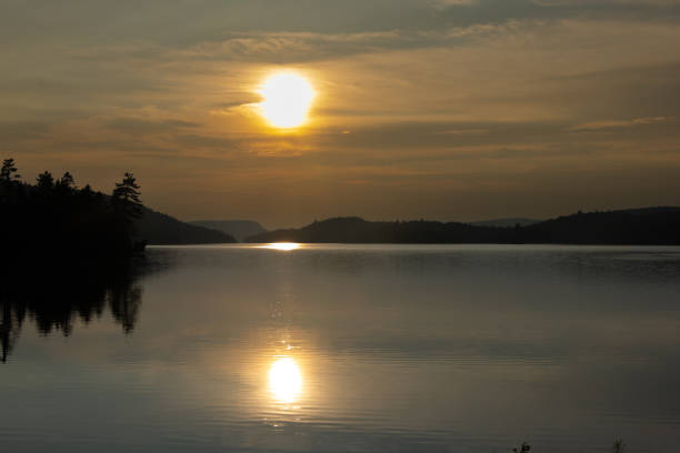 istock Sunset over a lake 2165297881