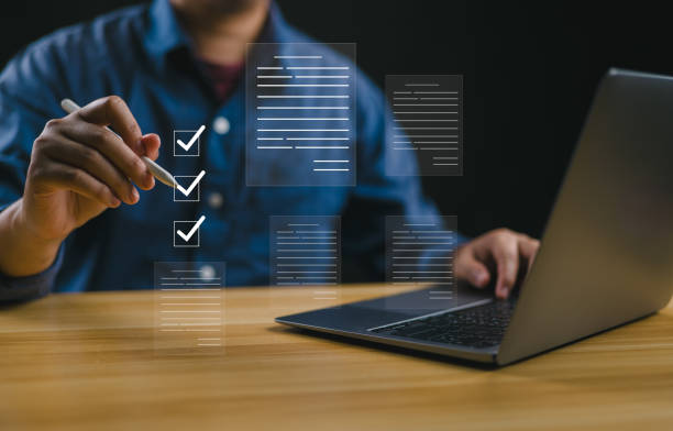 istock Businessman working on tablet to document management online for checklist and clipboard task management, filling survey form online, answer questions of test. Survey form concept. 2165299336