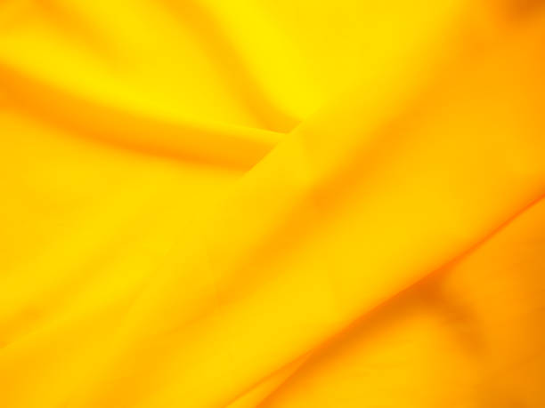 Elegant gold satin drape texture background.