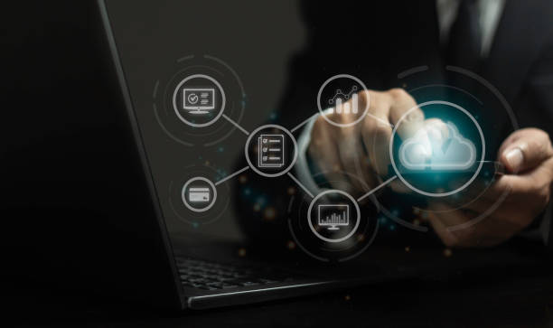 istock A person is using a laptop with a cloud icon on the screen 2165304809