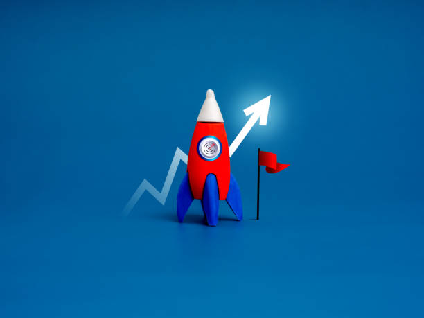 istock Red rocket with target icon parked next to the red flag with growing arrow behind on blue background, minimal. Creative innovation and ideas, inspiration, finance and business startup growth concept. 2165305109
