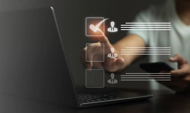 istock A person is using a laptop with a check mark on a screen 2165305513