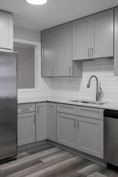 istock Corner Kitchen Setup With Grey Cabinets And Stainless Steel Fridge. 2165305651