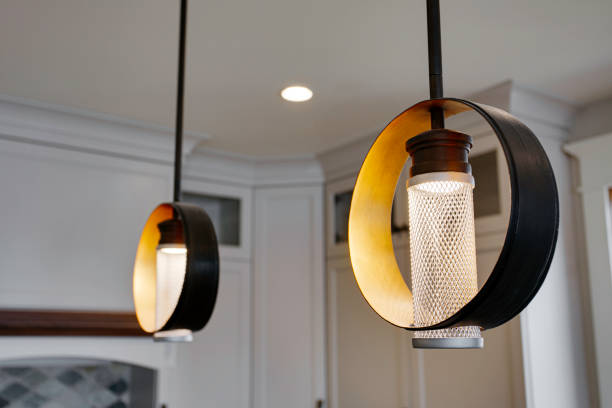 Modern Pendant Lights With Unique Circular Design Illuminating The Kitchen.