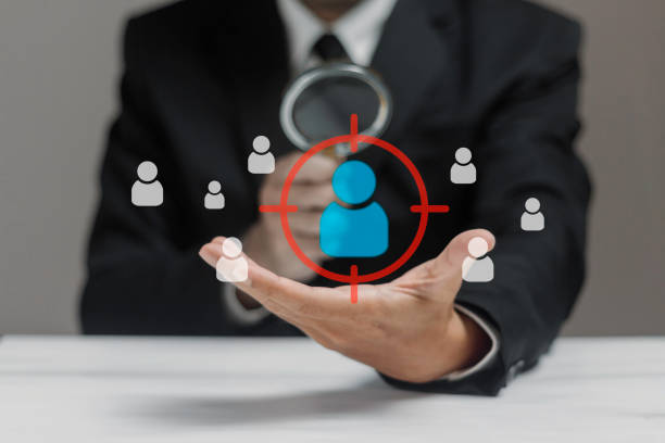 istock Businessman using magnifying glass with recruitment for  human resource in hand. Audit concept. 2165306197
