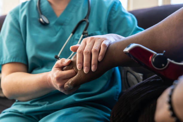 istock Nurse caring for patient during home visit 2165306301