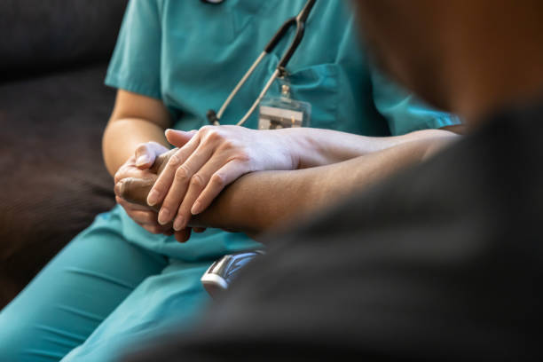 istock Nurse caring for patient during home visit 2165306302