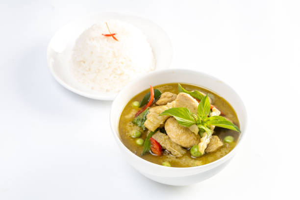 istock Chicken green curry with coconut shoots and rice  isolated on white background. 2165308320