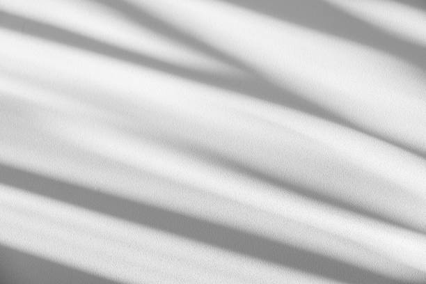 istock Studio style background wall decoration presentation uses white tones. with shadows cast from a nearby window, concept creating a decorative backdrop. 2165310963