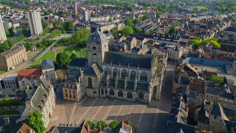 Notre-Dame Basilica, Alencon, Orne in Normandie, France. Aerial drone descending and cityscape