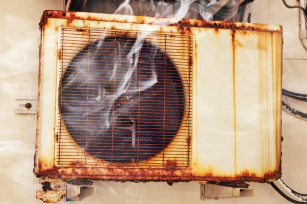 istock Old Air Conditioner On Building Wall 2165317181
