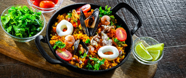 istock Seafood paella served in a cast iron pan 2165322273