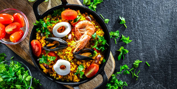 istock Seafood paella served in a cast iron pan 2165322392