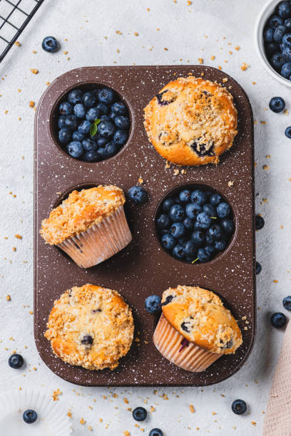istock Blueberry muffins and blueberry berries 2165324465