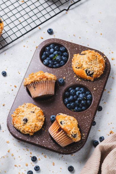 istock Blueberry muffins and blueberry berries 2165324473
