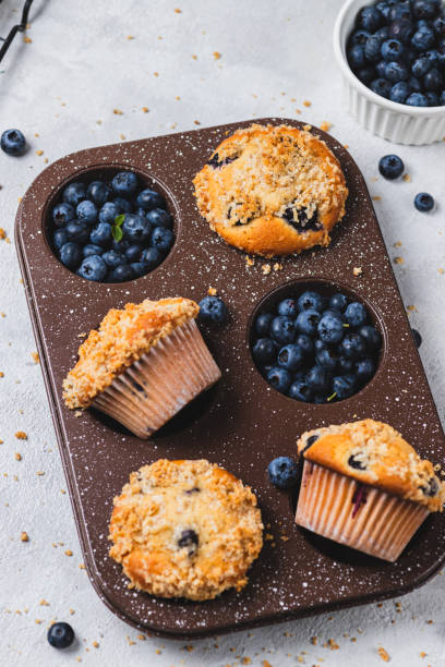 istock Blueberry muffins and blueberry berries 2165324476