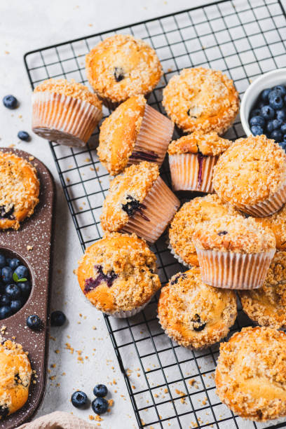istock Blueberry muffins and blueberry berries 2165324510