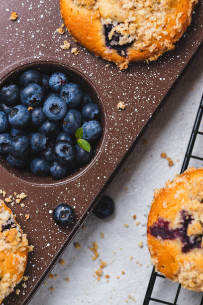 istock Blueberry muffins and blueberry berries 2165324512
