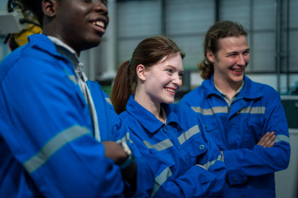 istock Portrait of Robotics engineers working with Programming and Manipulating Robot Hand, Industrial Robotics Design, High Tech Facility, Modern Machine Learning. Mass Production Automatics. 2165324530