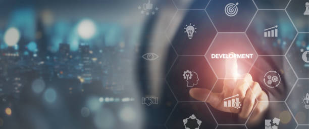 istock A futuristic digital interface highlighting various aspects of business development, with a businessman interacting by touching a screen. Emphasizing innovation development drive business growth. 2165326042