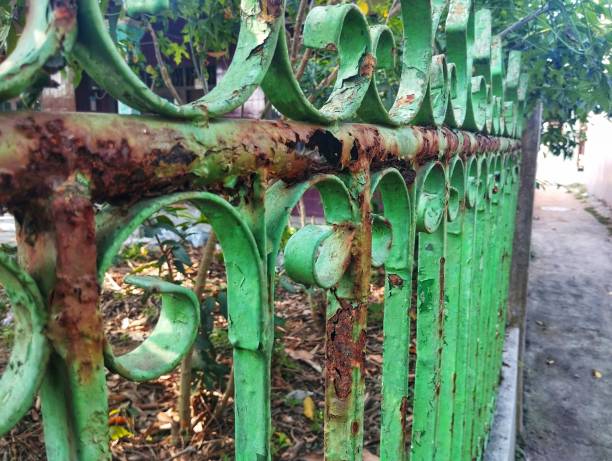 istock Rusty iron fence in the yard 2165331091