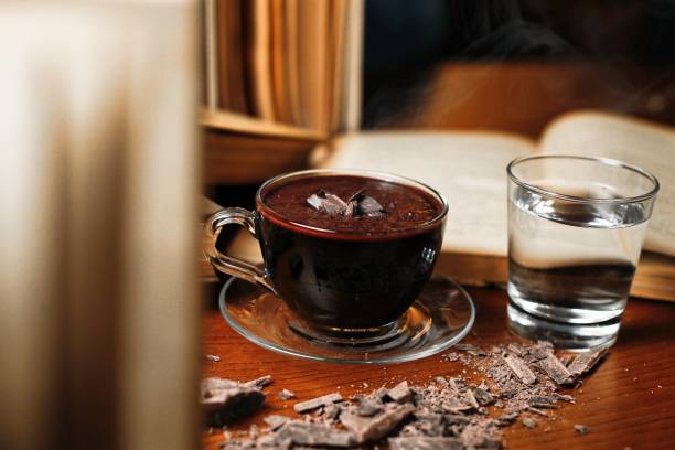 istock Hot Chocolate and Water on a Wooden Table 2165331329