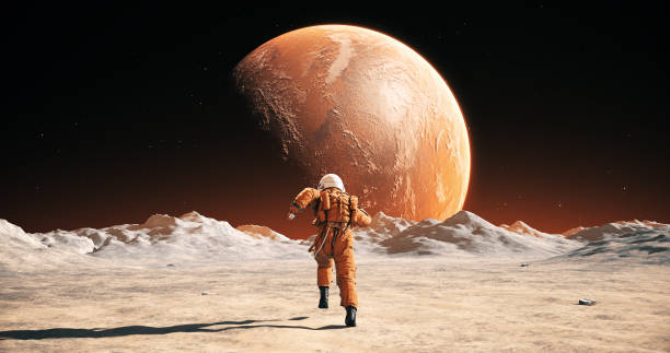 istock Male Astronaut In Space Suit Running On Alien Planet. Planet Mars Is Visible. 2165334382