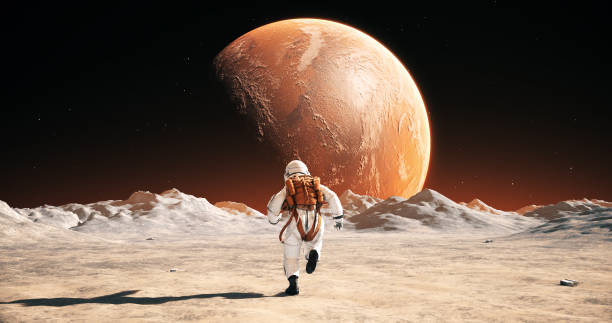 istock Astronaut On An Alien Planet Running To His Base. Mars Is Visible. 2165335004