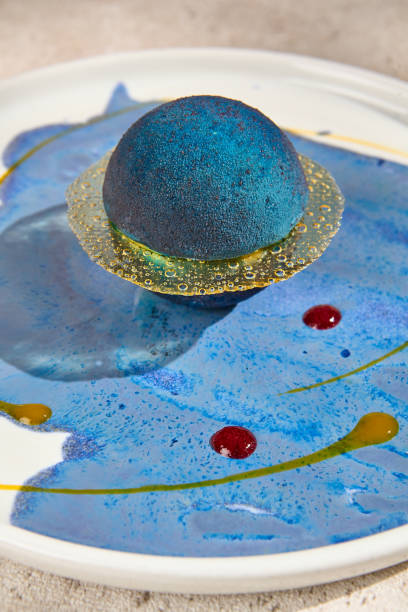 istock Planet-Shaped Galaxy Mousse Dessert with Summer Sunlight and Shadows 2165337273
