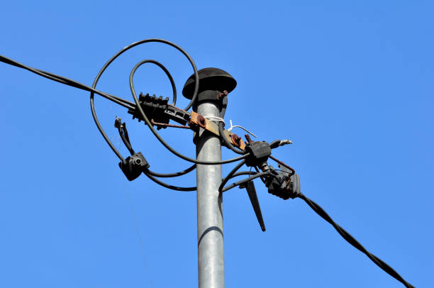 Electric cable installation pole from substation to house