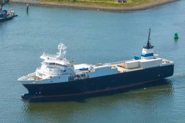 istock Reefer ship, refrigerated cargo vessel entering port seen from above 2165338344