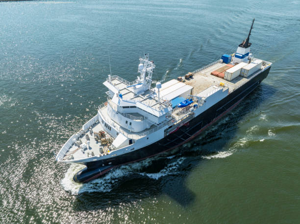 istock Reefer ship, refrigerated cargo vessel entering port seen from above 2165338535