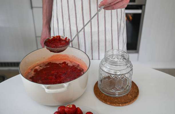 istock Person making sweet strawberry jam 2165339249