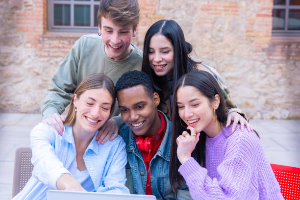 istock Students having fun with mobile phones creating content on social media. 2165340788
