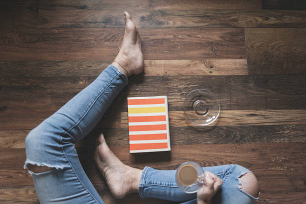 A woman reading a book at home