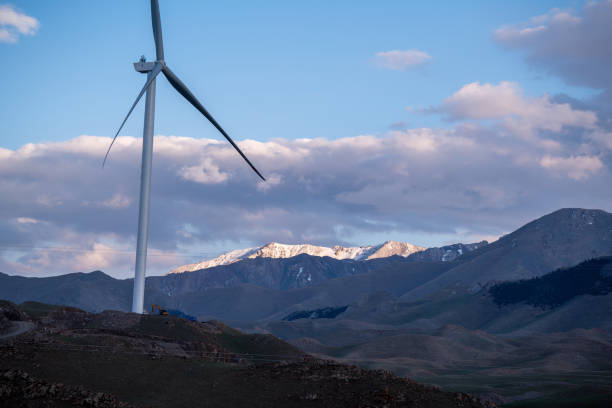 istock Dusk at Sayram Lake: Wind Turbines and Sunlit Snow-capped Peaks 2165347188
