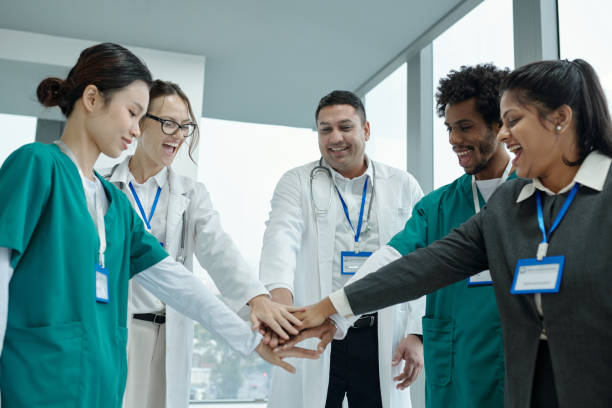 istock Team Of Doctors Supporting Each Other 2165347899