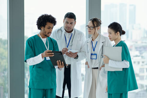 istock Doctor Consulting With Colleagues About Diagnosis 2165347987
