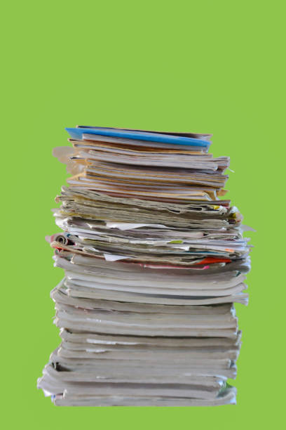 Slanted view of a stack of different newspapers, folded and placed one on the other