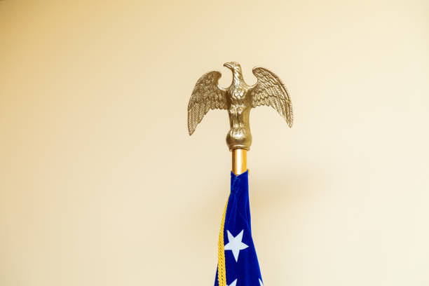 istock Golden Eagle Topper on American Flag 2165349629