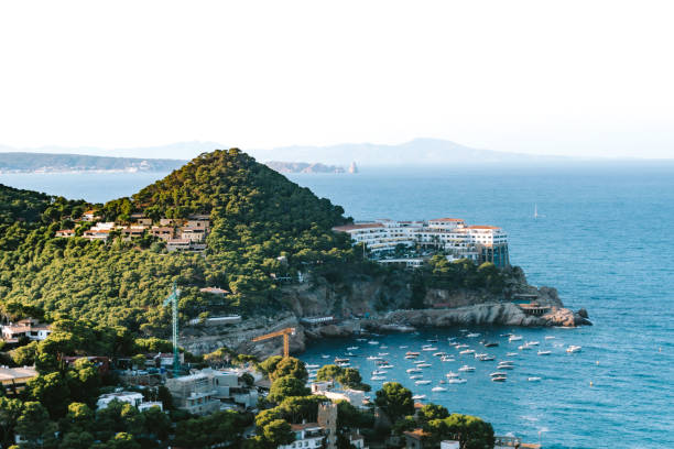 View of Cala Aiguafreda from a hill above the mediterranean sea.