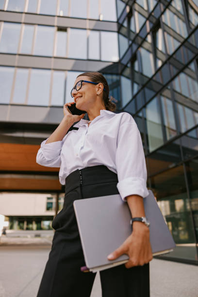 istock A highly professional businesswoman confidently navigating her modern urban environment, 2165353184