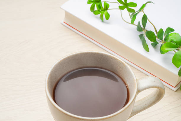 istock Hot cocoa isolated on wooden table 2165357549